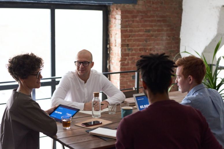 meeting at a table with tablets