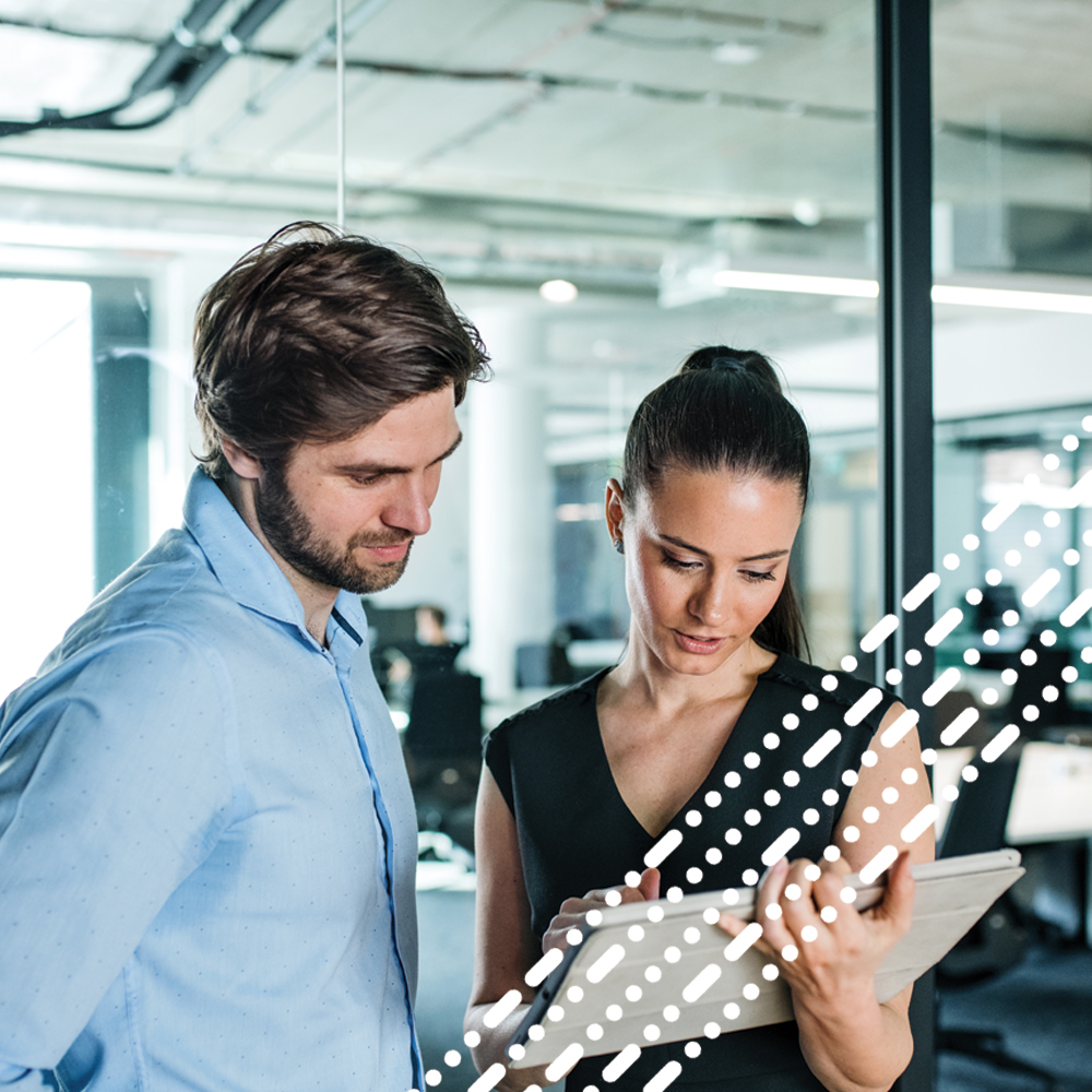 male and female looking at tablet