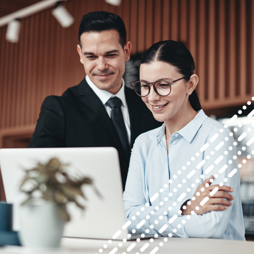 male and female looking at laptop