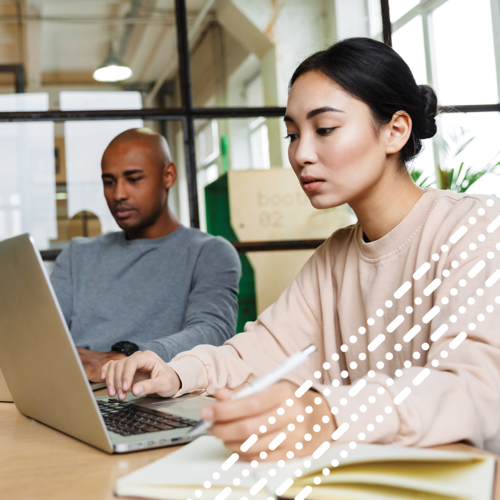 male and female working onlaptop