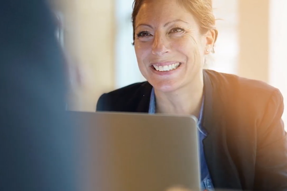 readiness wins smiling woman at computer