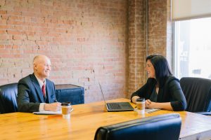 Man and female having a meeting in office