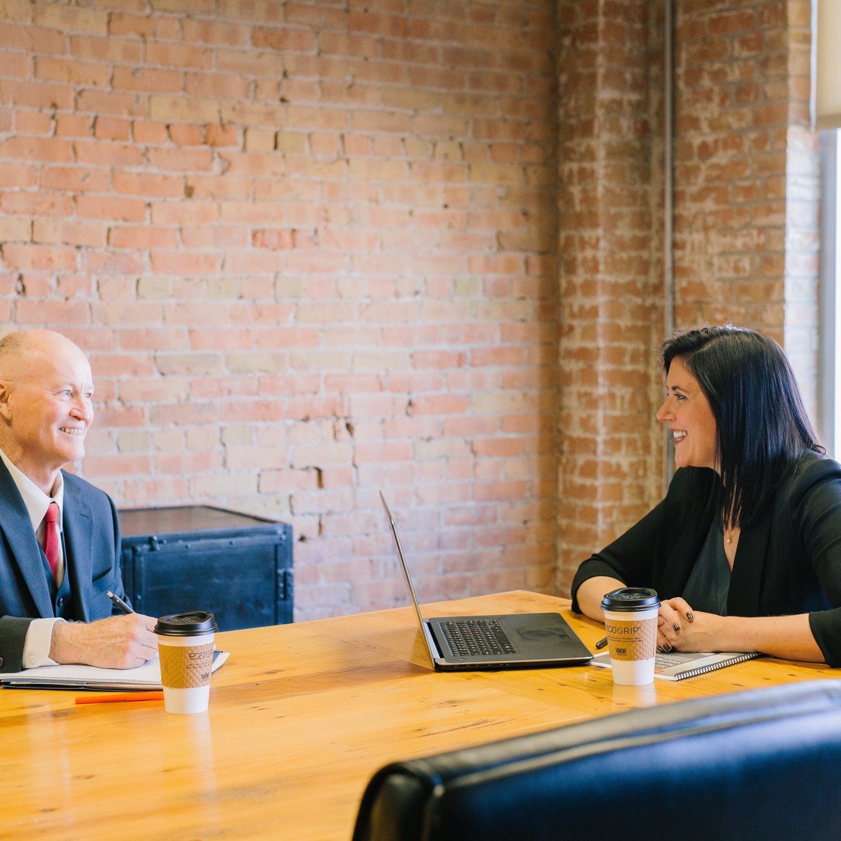 Man and female having a meeting in office