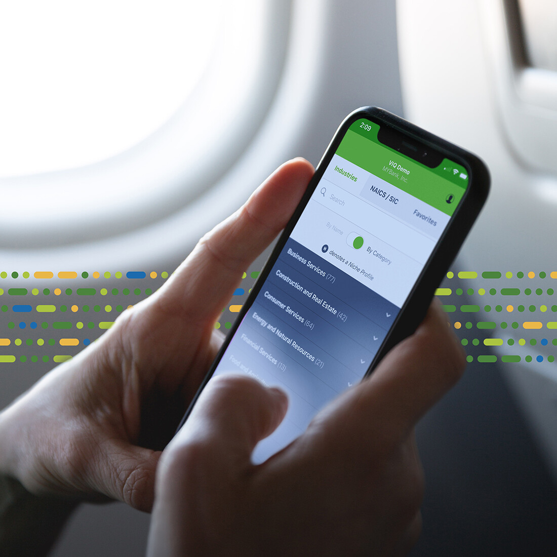 on a plane looking at mobile