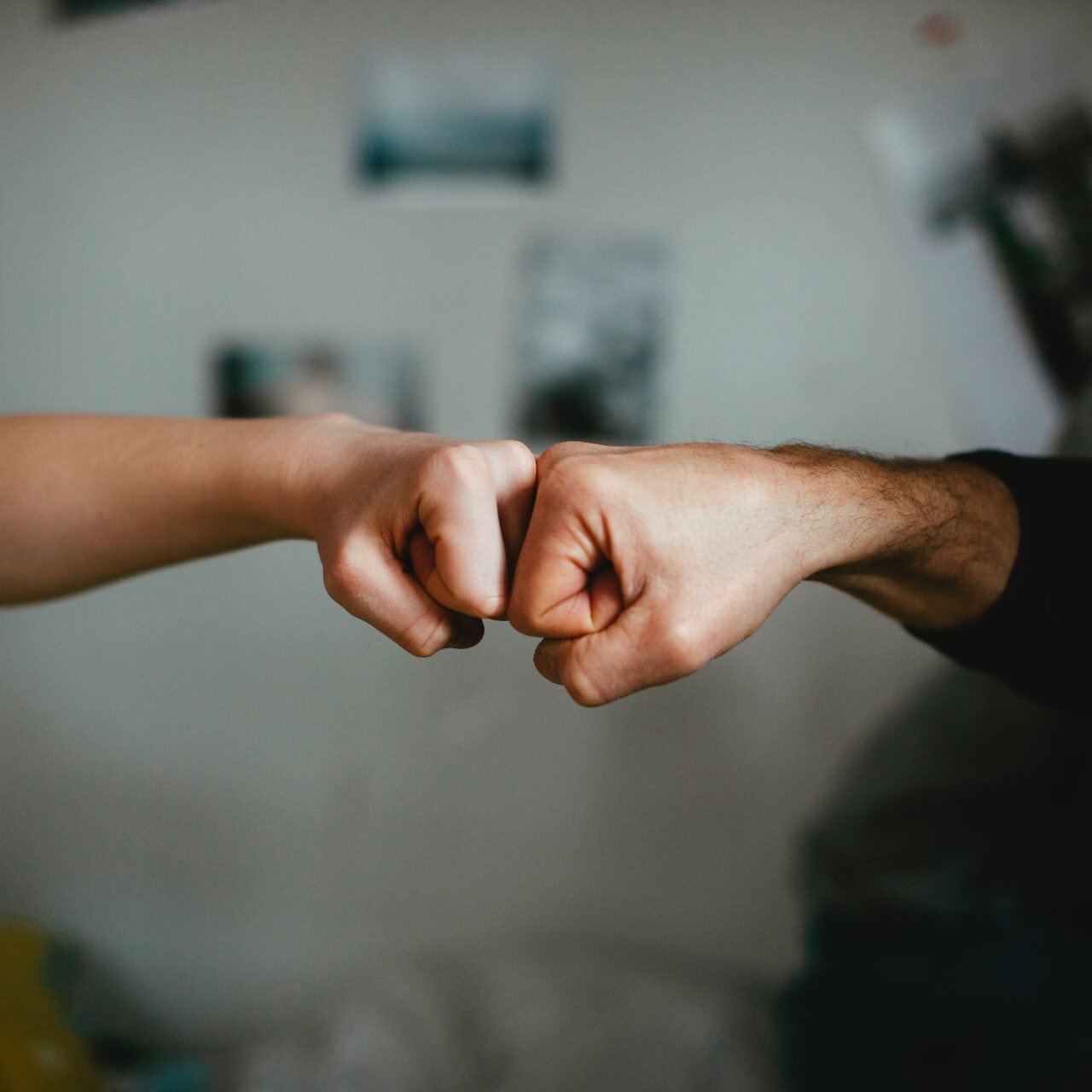 customer success team; fist bump