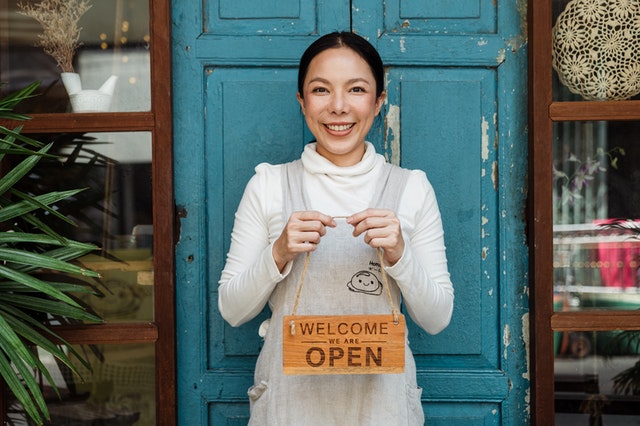 small business platform lending ; small business owner with "OPEN" sign