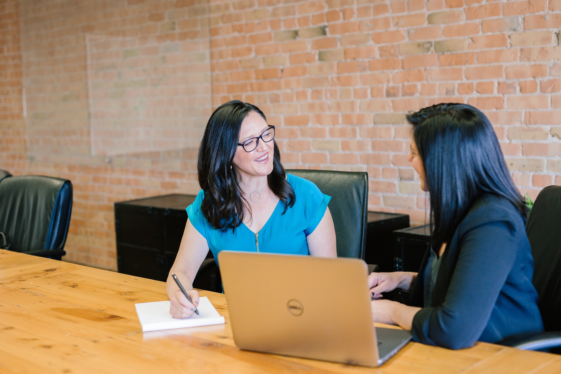 business women at table banking sales enablement