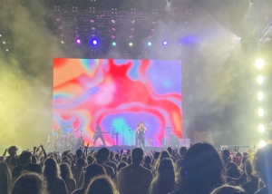 crowd in front of stage with band playing