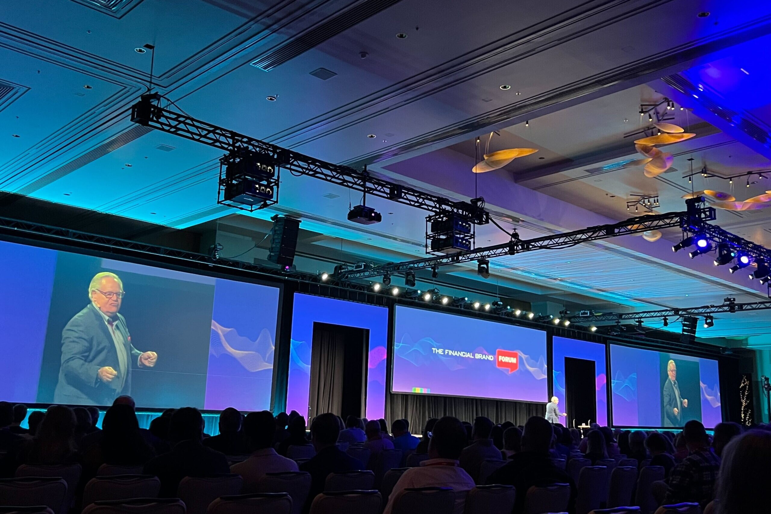 financial speaker on stage