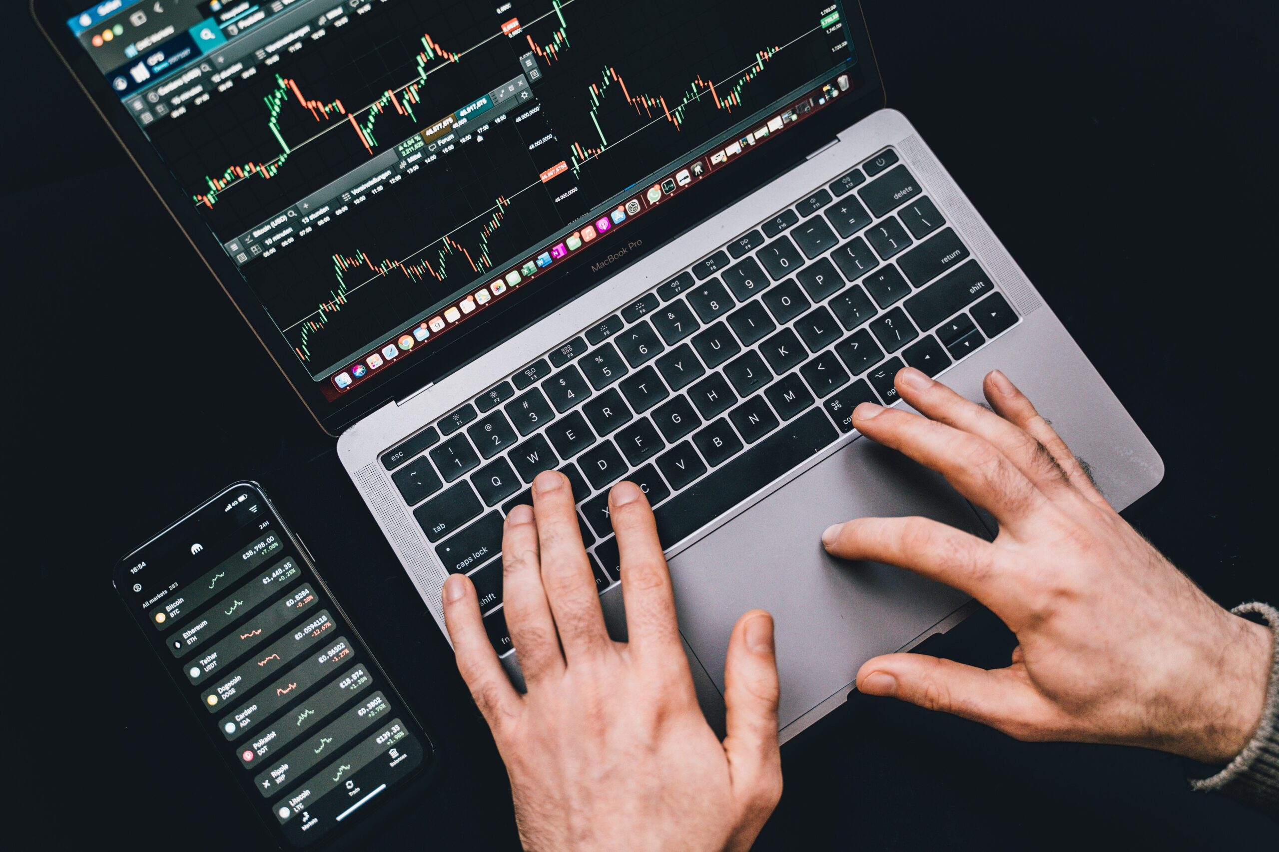 Typing on a computer viewing the stock market trends