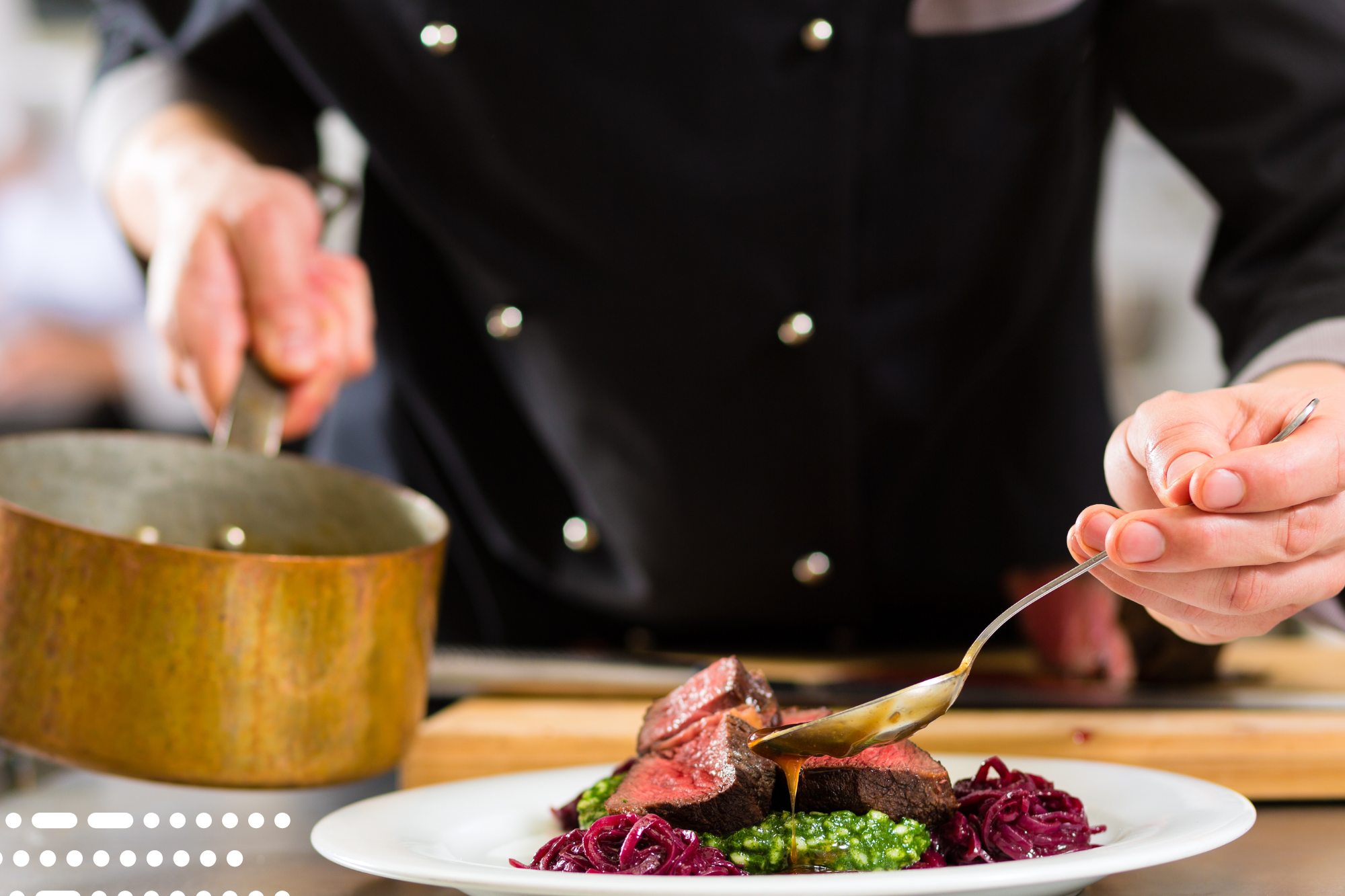 Chef pouring sauce on medium rare steak