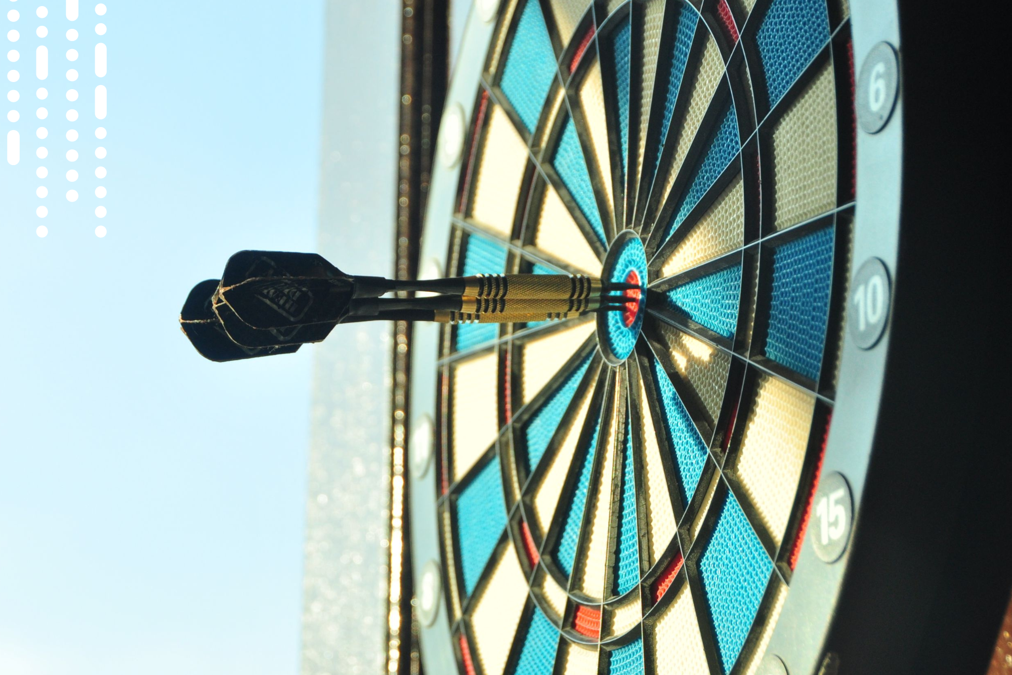 Dart board with a dart on the bullseye