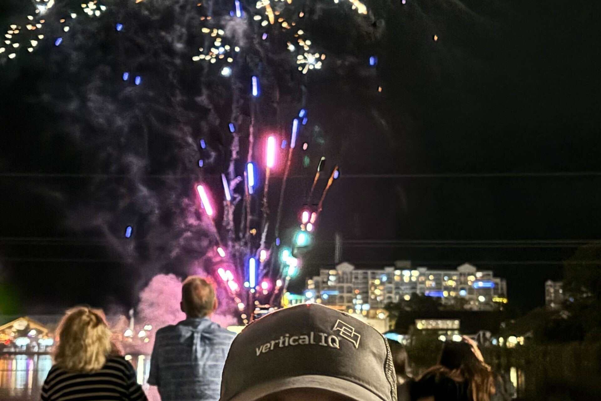 Vertical IQ VP of marketing standing in front of a firework on 4th of July