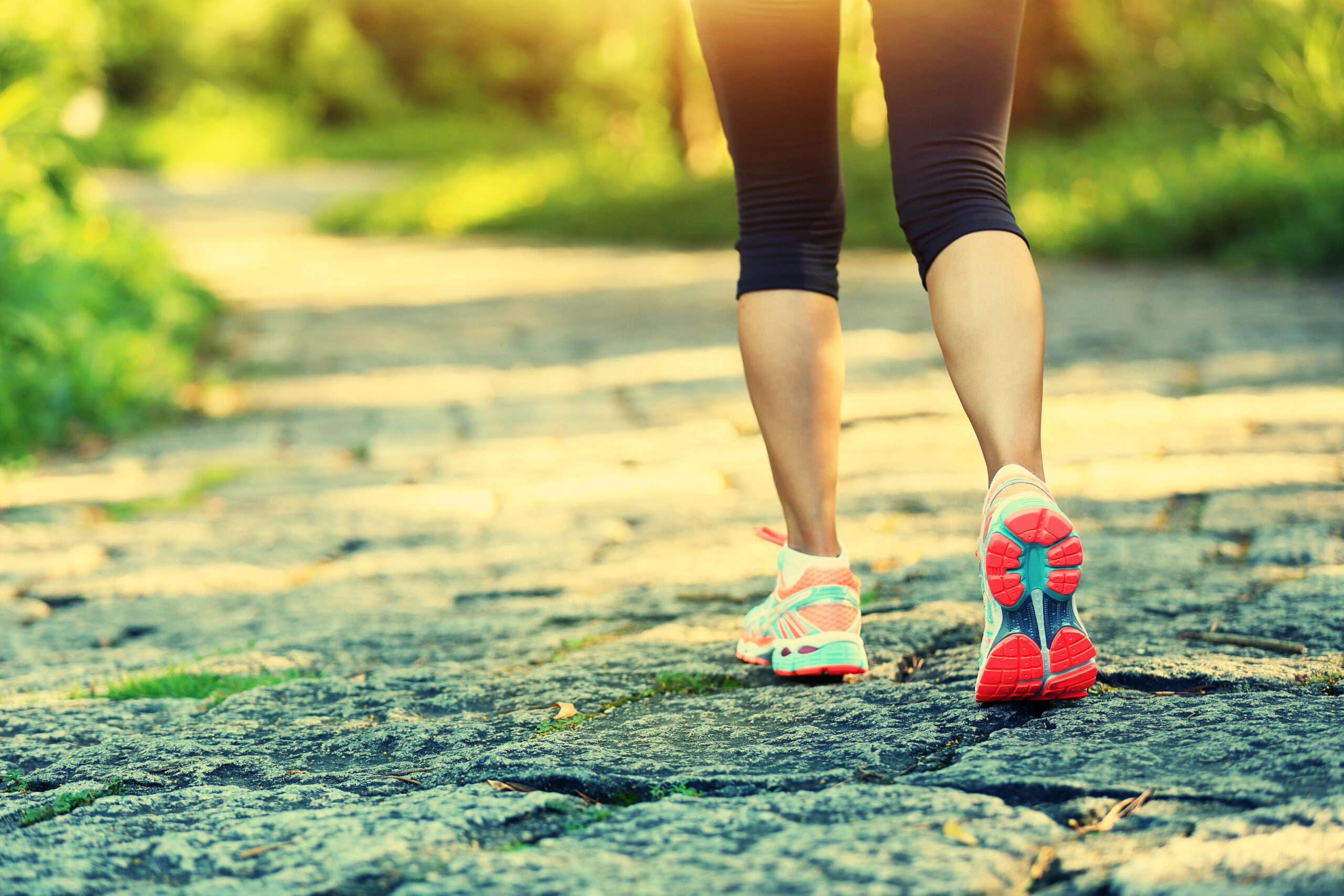 Woman running outside on a trail