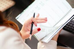 pexels-god-picture-369194295-14465808; woman turning calendar page; adding ongoing value