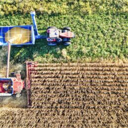 ag lending; combine harvesting grain