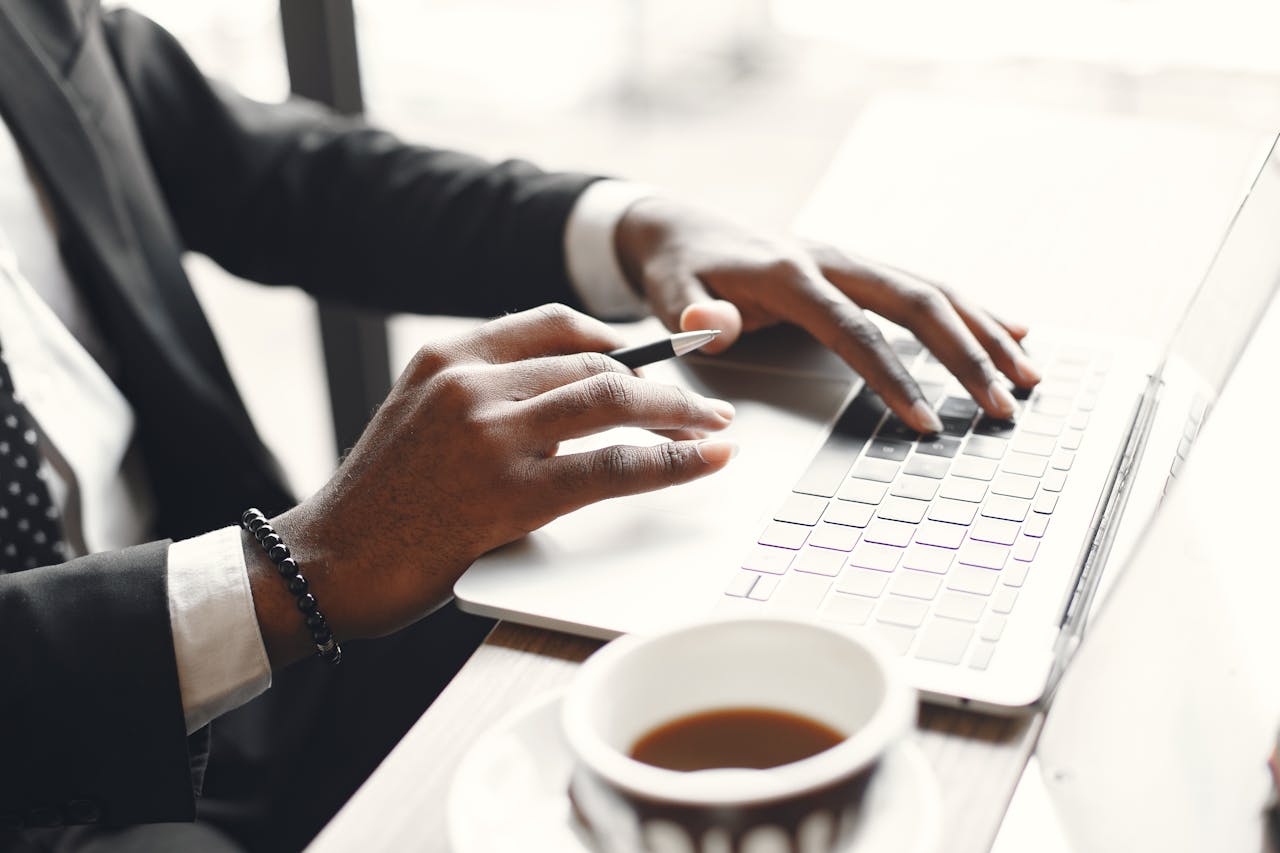 pexels-gustavo-fring-7446947 close up of businessman using a laptop