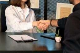business person shaking hands with a client